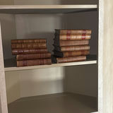 Decorative Leather-Bound Books and Framed Wall Mirror - thumbnail 1 of 6
