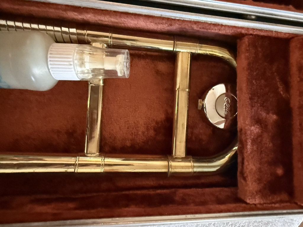 Brass trombone in a brown plush-lined case - image 4 of 7