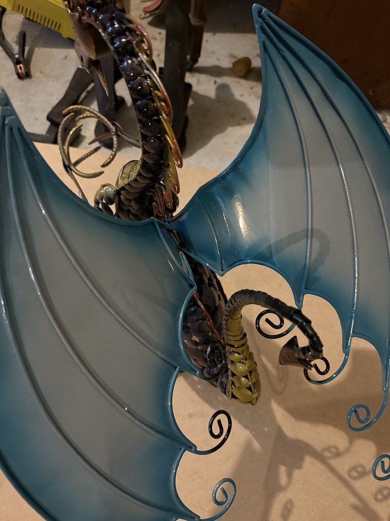 Metal dragon sculpture with blue wings - image 4 of 5