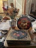 Floral decorative tins, a ceramic vase with fabric roses, and a decorative plate with a vintage photo - thumbnail 1 of 6