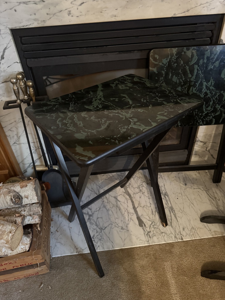 Black metal folding tables with green marble-pattern laminate tops - image 1 of 8