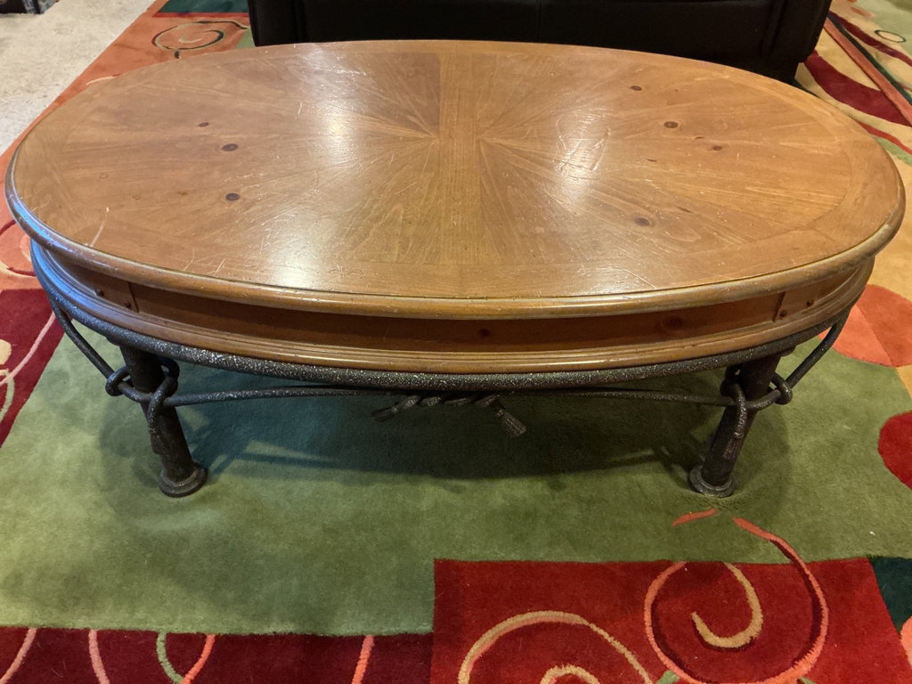 Oval wooden coffee table with metal base - image 1 of 4