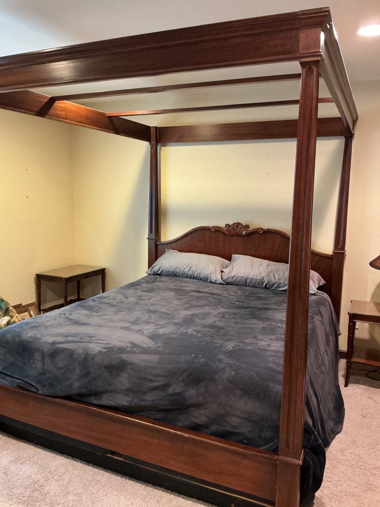 Wooden four-poster king canopy bed with carved headboard - image 1 of 9
