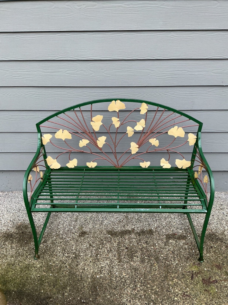 Green metal garden bench with leaf motif and large stone planter - image 2 of 6