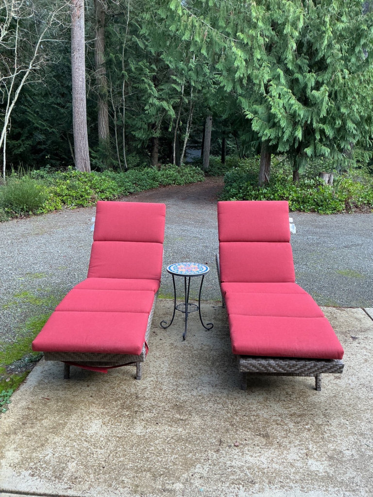 Outdoor wicker chaise lounges with red cushions and mosaic-topped table - image 1 of 6