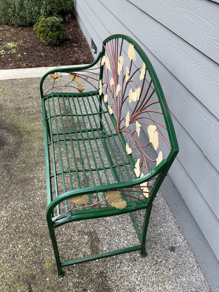 Green metal garden bench with leaf motif and large stone planter - image 3 of 6