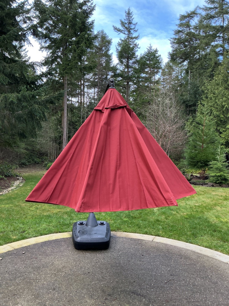 Large Red cantilever patio umbrella with base and protective sleeve - image 3 of 6
