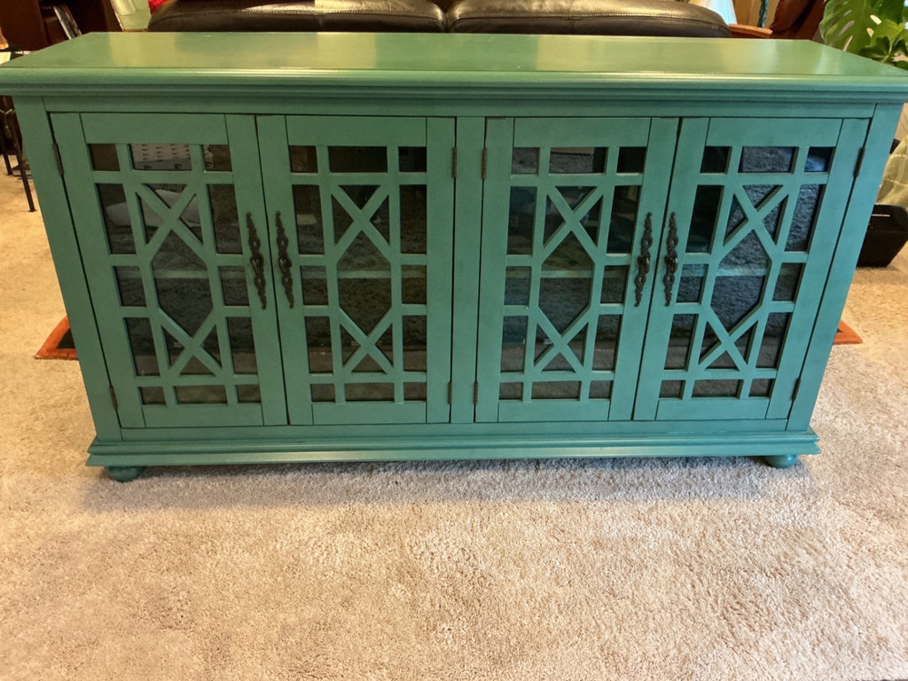Teal-green lattice-door cabinet - image 1 of 6