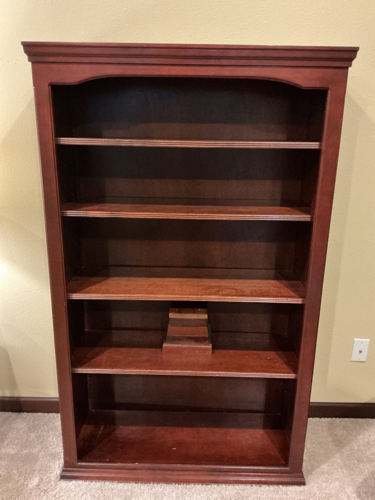 Dark wood bookshelf with five shelves and a stepped pedestal - image 1 of 4