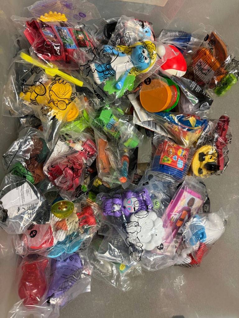 Assorted small toy figures and accessories in bags - image 1 of 6