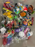 Assorted small toy figures and accessories in bags - thumbnail 1 of 6