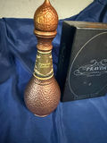 Hammered copper Turkish coffee decanter, Pravda vodka tasting kit, and ceramic bear statue - thumbnail 1 of 5