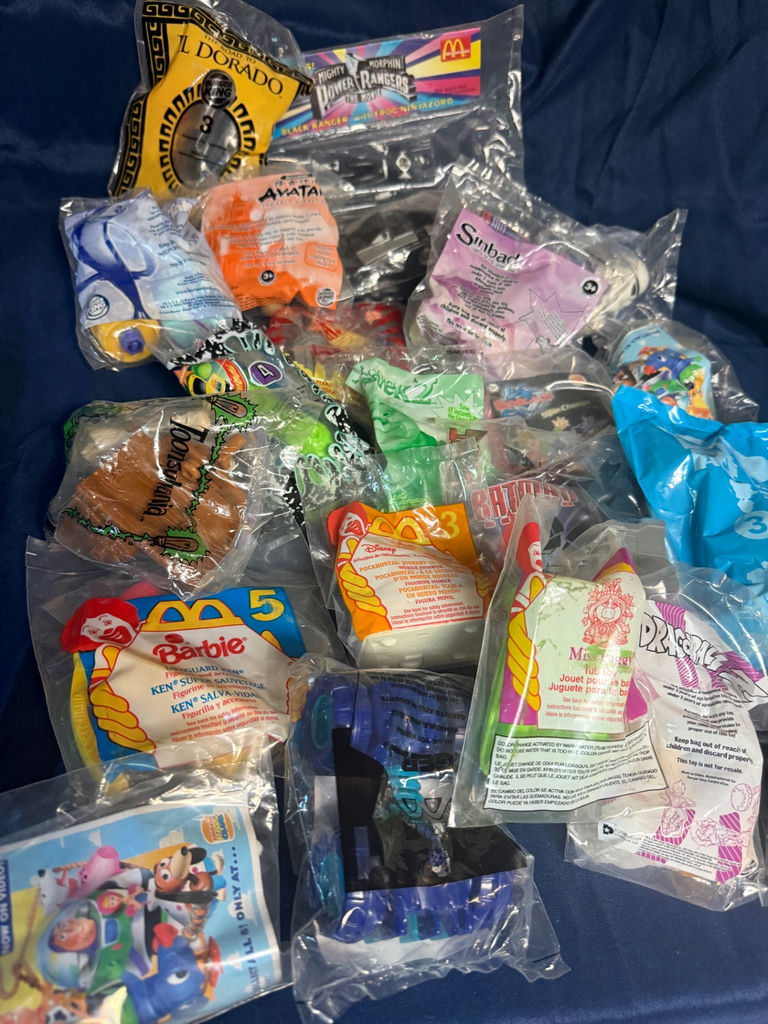 Assorted sealed toy bags and figure packs - image 1 of 6