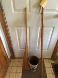 walking sticks and a broom in a metal bucket - thumbnail 2 of 4
