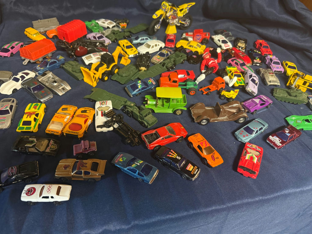 Assorted toy vehicles (die-cast cars, trucks, motorcycles, and military/construction vehicles) - image 1 of 4