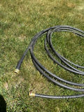 Coiled black hose with brass fittings - thumbnail 2 of 2