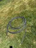 Coiled black hose with brass fittings - thumbnail 1 of 2