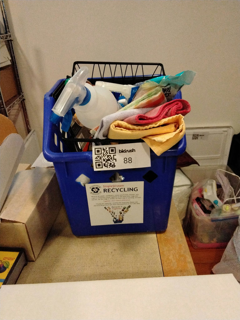 Blue recycling bin filled with cleaning supplies and drop cloths - image 1 of 3