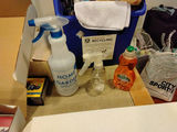 Blue recycling bin filled with cleaning supplies and drop cloths - thumbnail 2 of 3