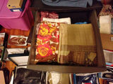Stacked storage drawers with clothing and fabrics - thumbnail 2 of 6