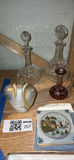 Crystal decanters, a heart-shaped vase, and a seaside tile - thumbnail 1 of 5