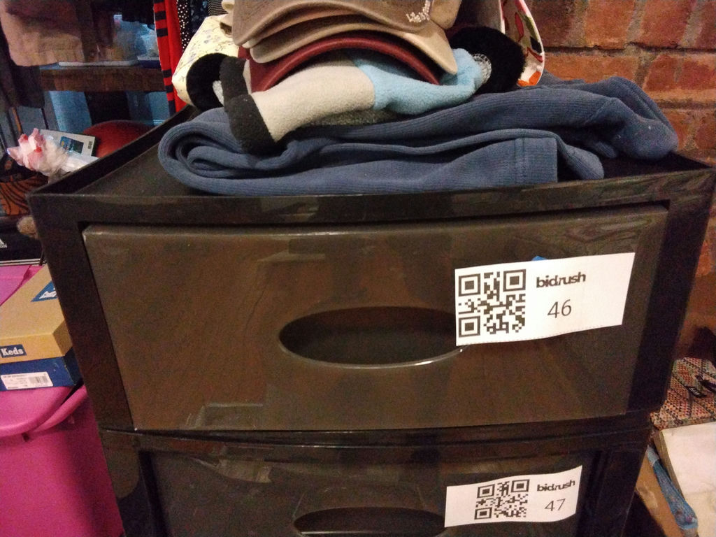 Stacked storage drawers with clothing and fabrics - image 6 of 6