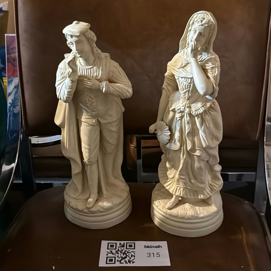Pair of white porcelain figurines: man and woman in historical dress - image 1 of 2