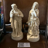 Pair of white porcelain figurines: man and woman in historical dress - thumbnail 1 of 2