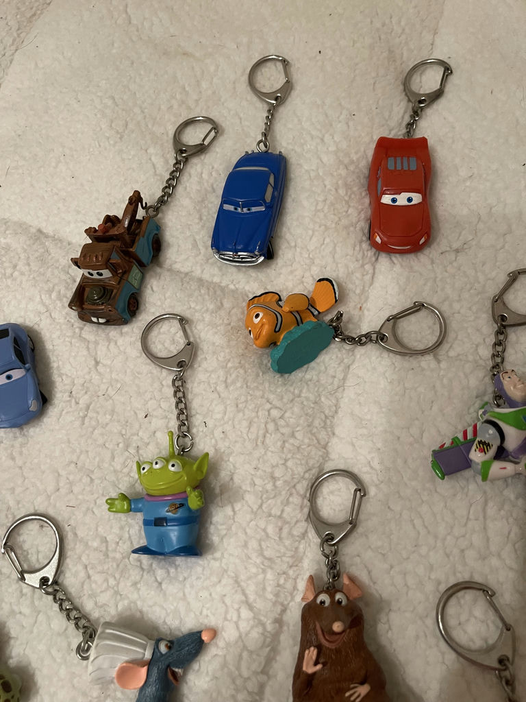 Assorted Disney and Pixar Character Keychains and Figurines With. Spider-Man Popcorn tin - image 5 of 7