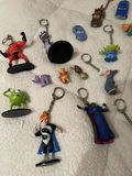 Assorted Disney and Pixar Character Keychains and Figurines With. Spider-Man Popcorn tin - thumbnail 4 of 7