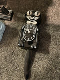 Home Decor Items Including Magazine Holder, Rack, Vase, Ceramic Boots, and Kit-Cat Clock - thumbnail 2 of 9