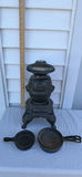 Vintage Arnel’s Pottery Comfort Potbelly Stove with Four Cast Iron Skillets - thumbnail 1 of 12