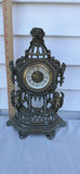 Ornate Vintage Metal Mantel Clock with Cherub Figures - thumbnail 1 of 7