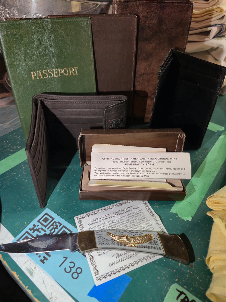 Passport cover, wallets, gloves, and collectible eagle pocket knife with certificate - image 1 of 5
