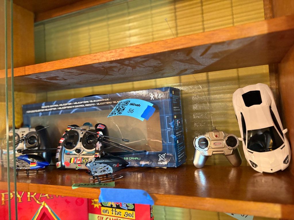 Collection of remote-controlled helicopters and car - image 1 of 8
