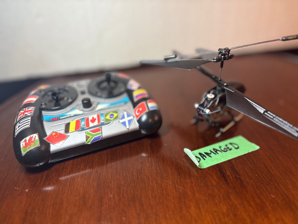 Collection of remote-controlled helicopters and car - image 5 of 8
