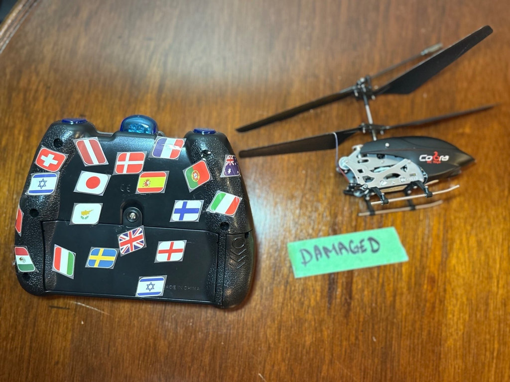 Collection of remote-controlled helicopters and car - image 8 of 8
