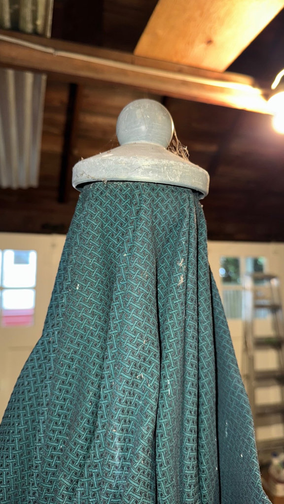Folded green patterned outdoor umbrella with base - image 2 of 5