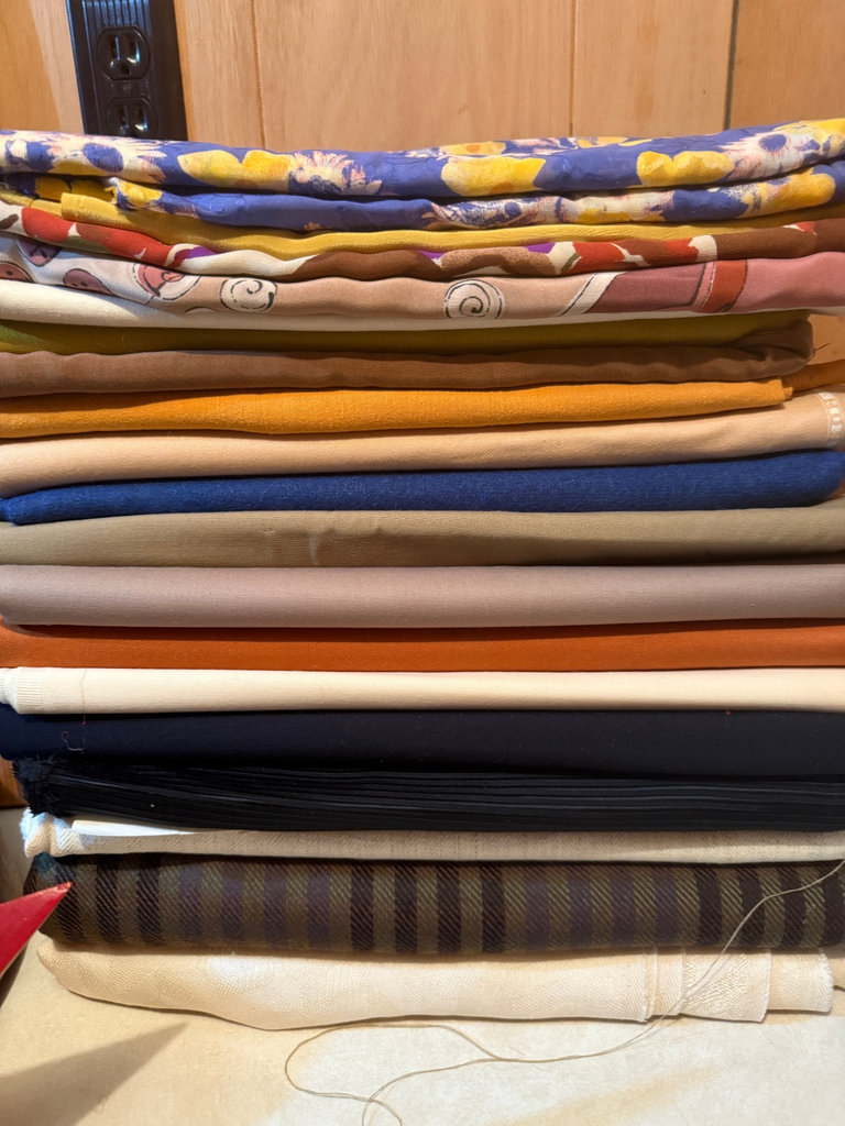 Stack of folded fabrics - image 1 of 3