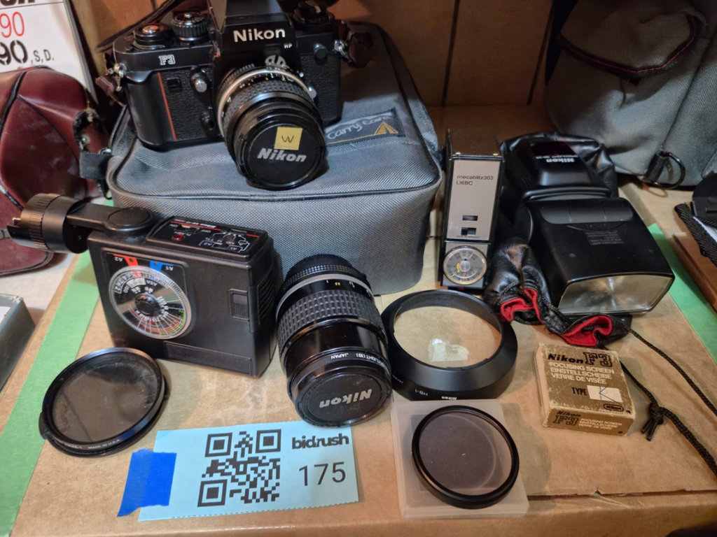 Nikon film camera with lenses and accessories - image 1 of 7