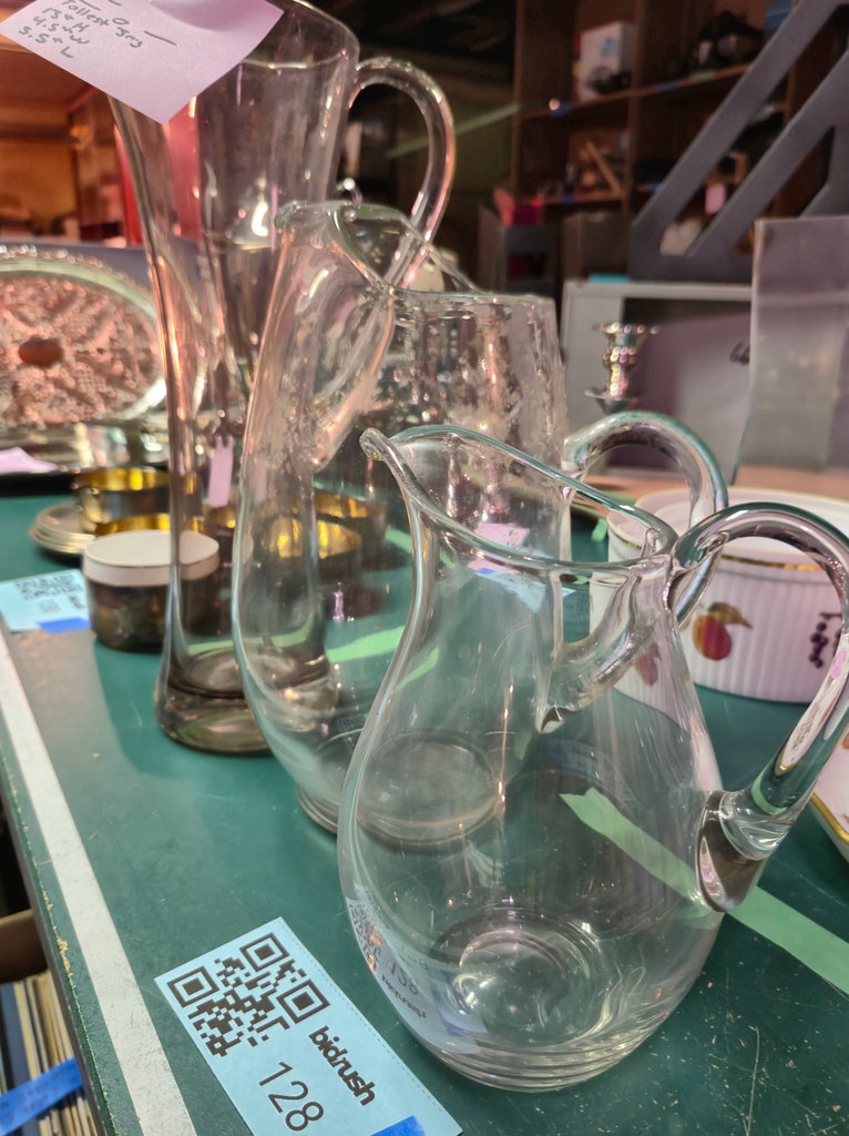 Set of clear glass pitchers and a carafe with assorted glassware - image 1 of 4