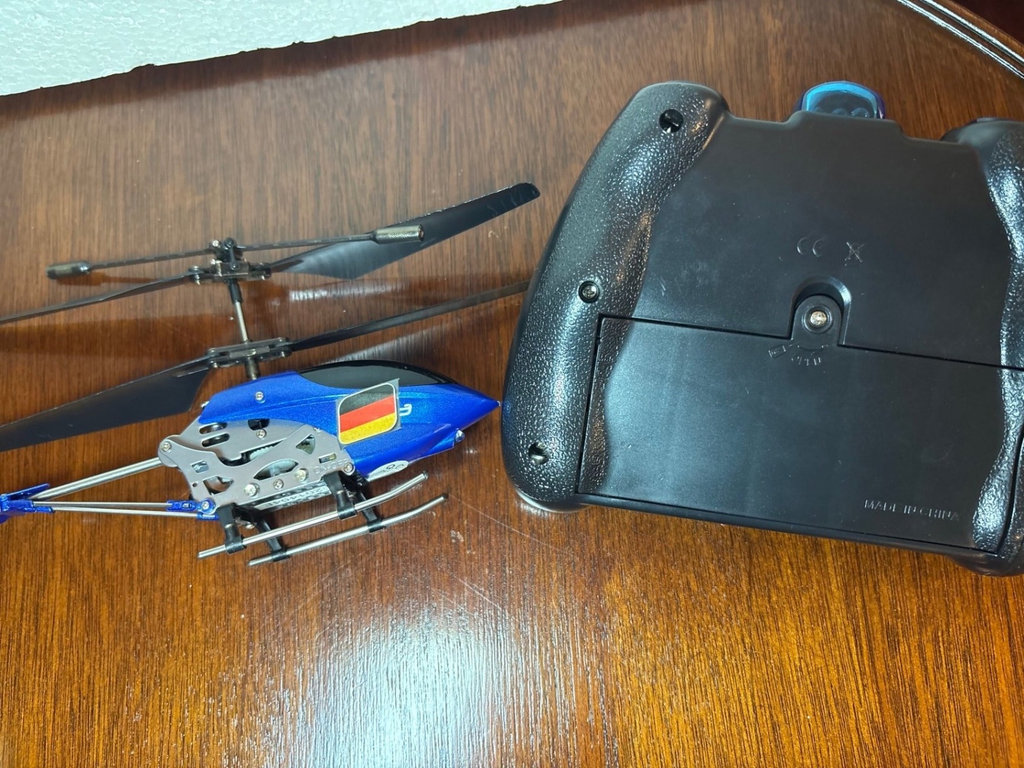 Collection of remote-controlled helicopters and car - image 6 of 8