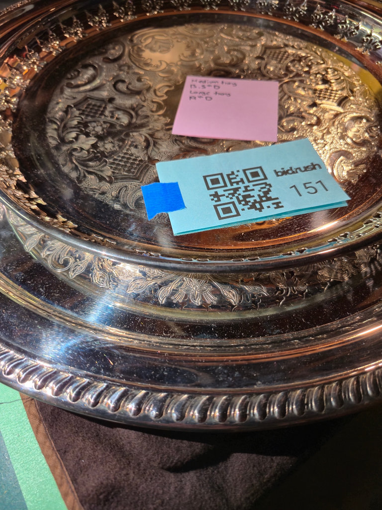Ornate round silver plated serving trays - image 1 of 5