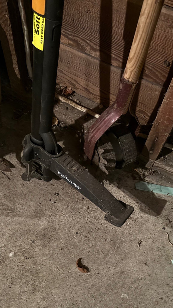 Garage tool collection with shovels, cords, and tarps - image 5 of 6
