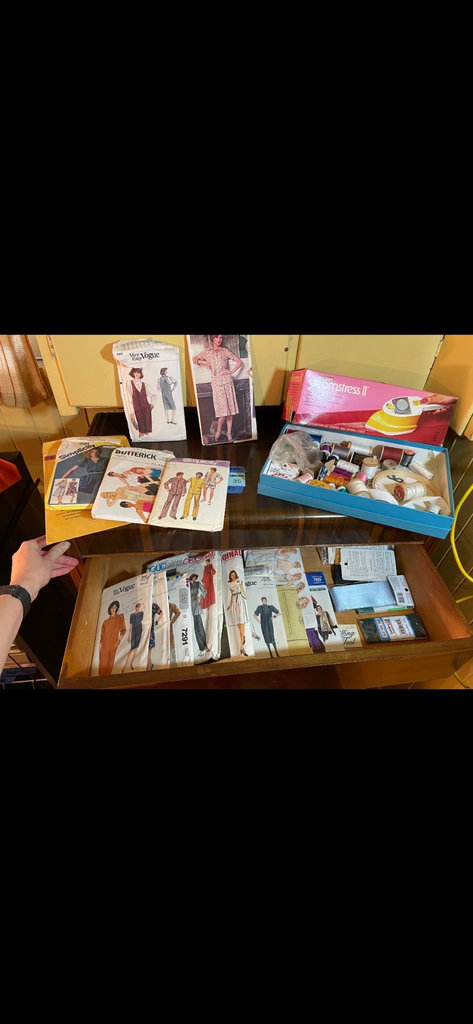 Vintage sewing patterns with fabric scraps and sewing tools - image 2 of 7