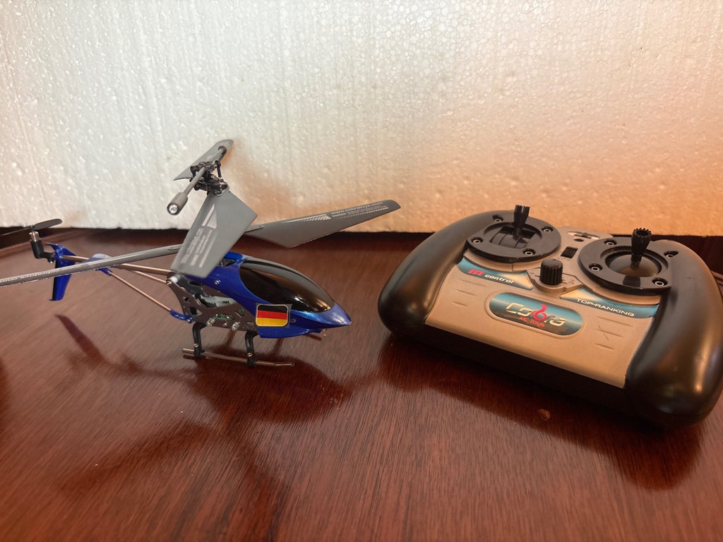 Collection of remote-controlled helicopters and car - image 4 of 8