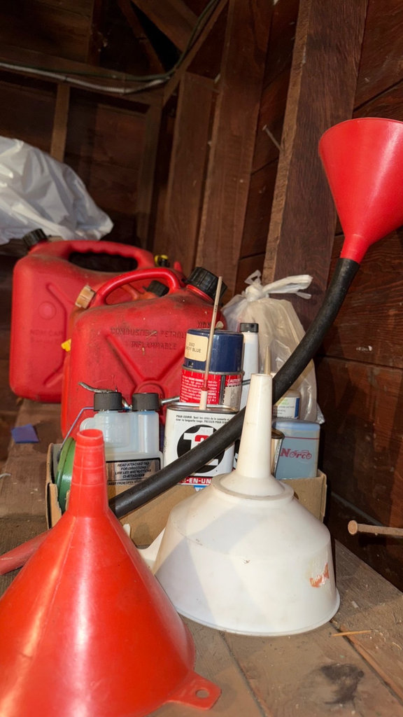 Assorted red gas cans and automotive supplies - image 2 of 3