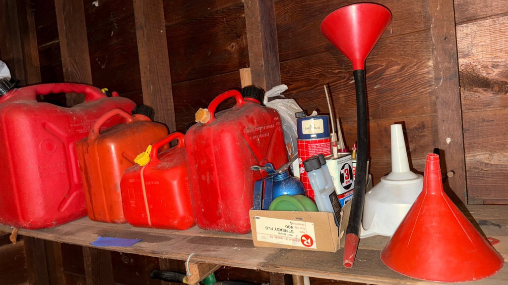 Assorted red gas cans and automotive supplies - image 3 of 3