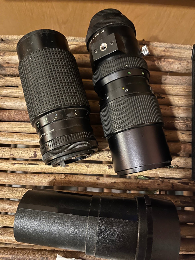 Three camera lenses with a lens case - image 1 of 1