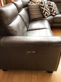 Dark gray leather sectional sofa with power recliners and decorative pillows - thumbnail 4 of 6